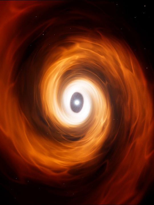 The vortex closes into a spiral around a bright eye