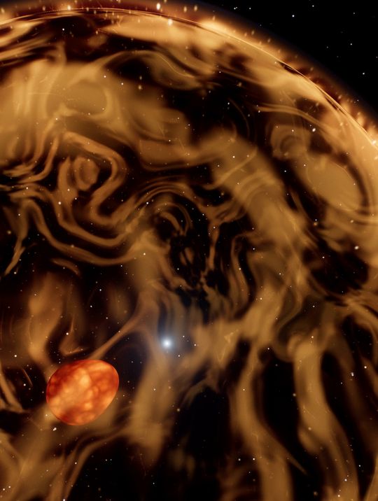 The shell: a sphere of gold gas fractures across the frame