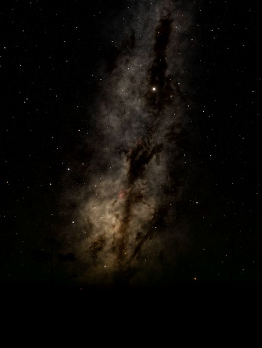 The Milky Way over a dark horizon with a new star